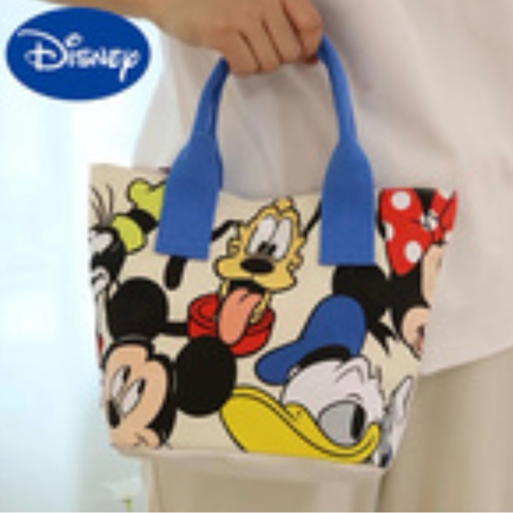 Disney small handbag,w/ blue handles ,shows Mickey Mouse, Goofy and Donald Duck